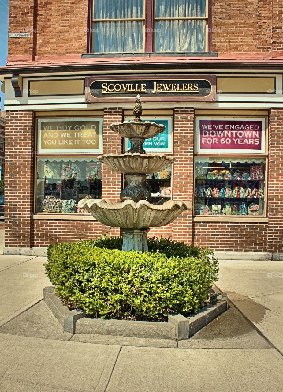 The Fountain at the Point. This welcoming fountain sits at the point where Glen and Ridge sts. meet in Glens Falls,  NY. behind the fountain is Scoville's jewelers.