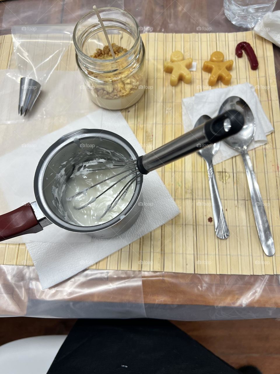 Working desk with wax and jar for making candles 