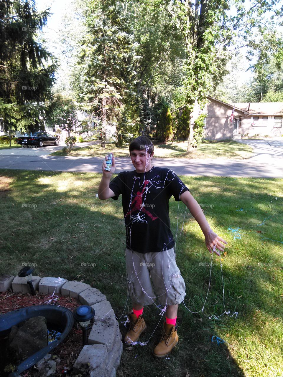 silly string. teenage boy engaged in silly string fight