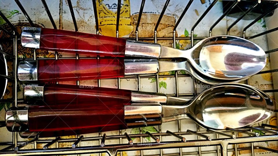 Teaspoons. Red and silver teaspoons that live in my kitchen.