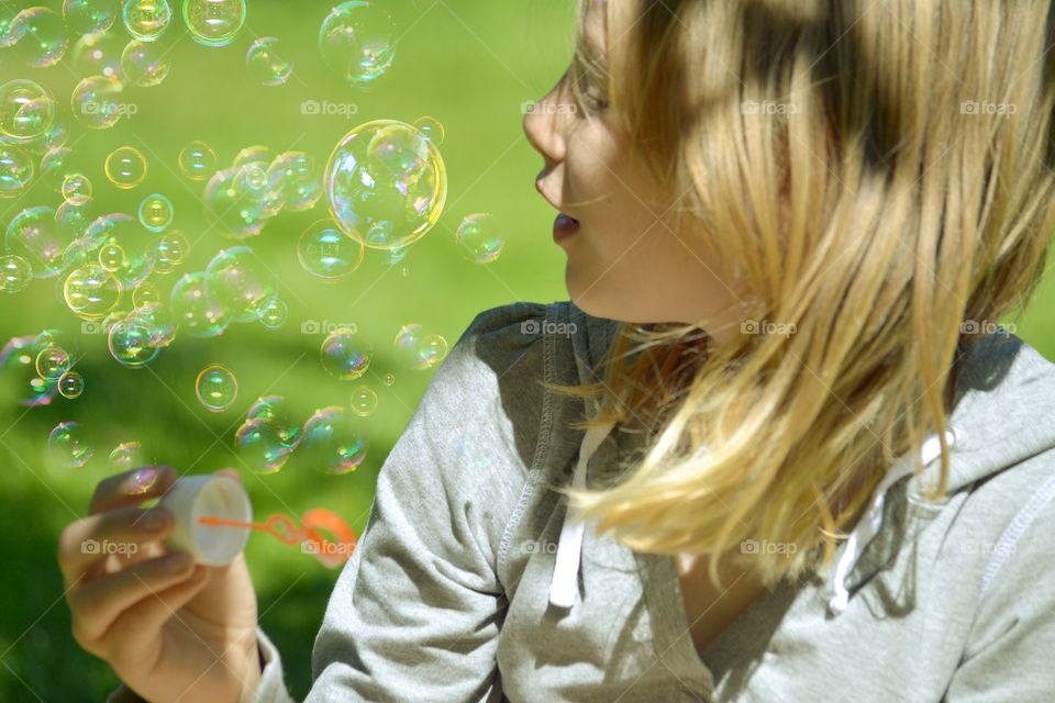 Girl blowing bubble