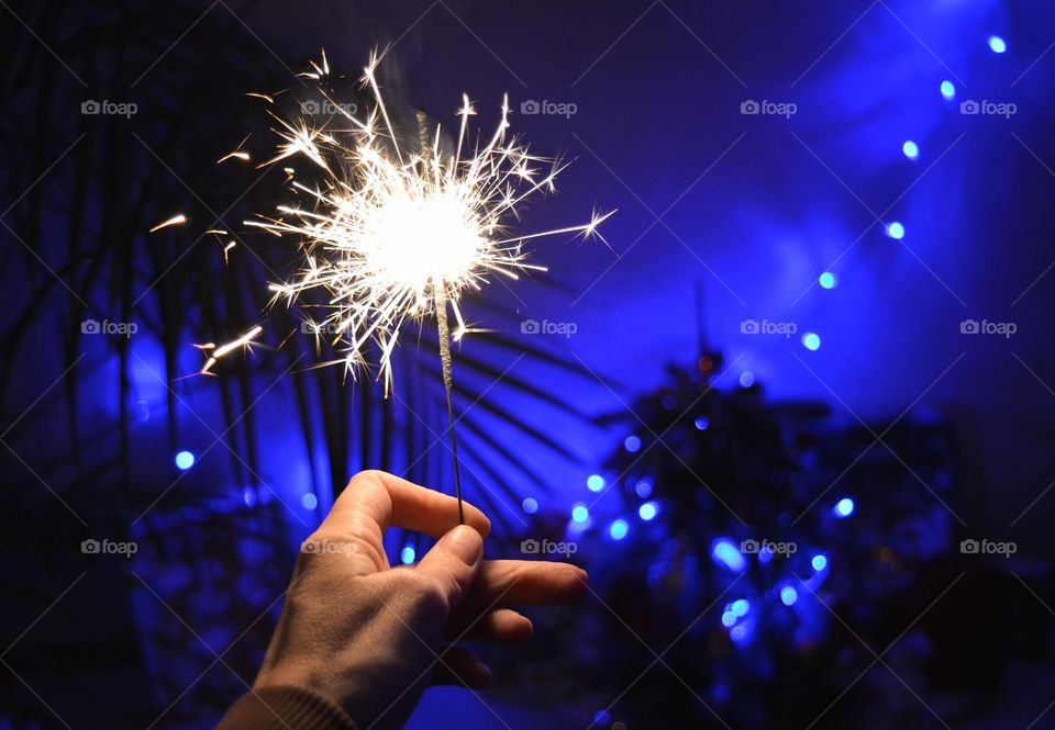 New Year sparkle in hand home blue