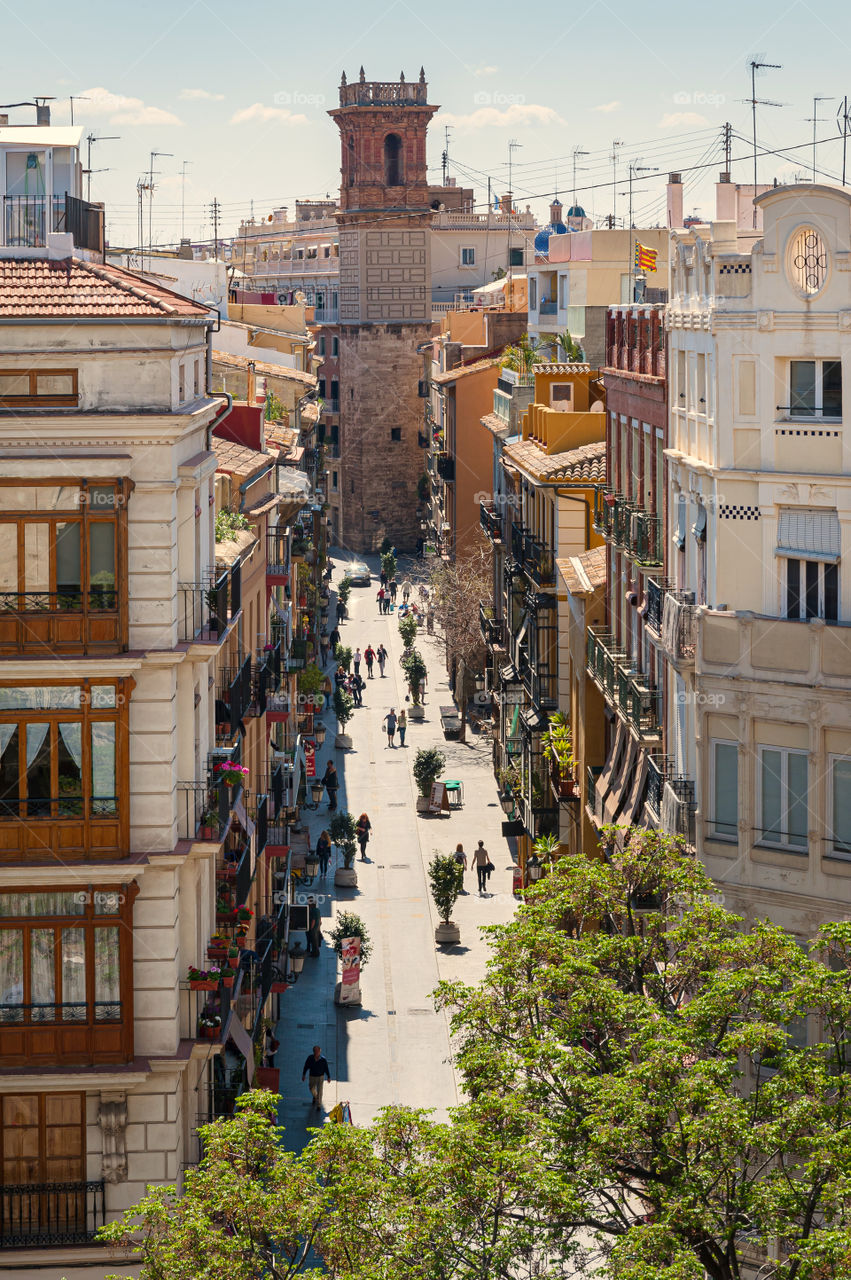 View at Valencia downtown with people walking in the street. Spain.