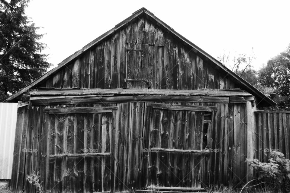 old wooden barn in the village of Zhukin, Kiev region