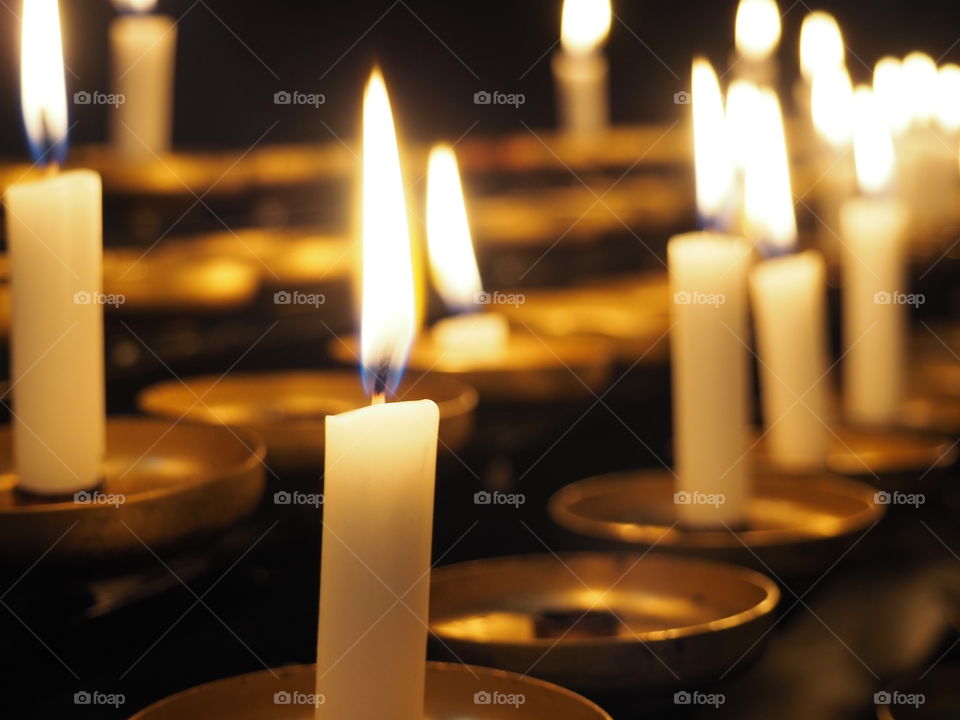 close up of candles with warm and soft candle light