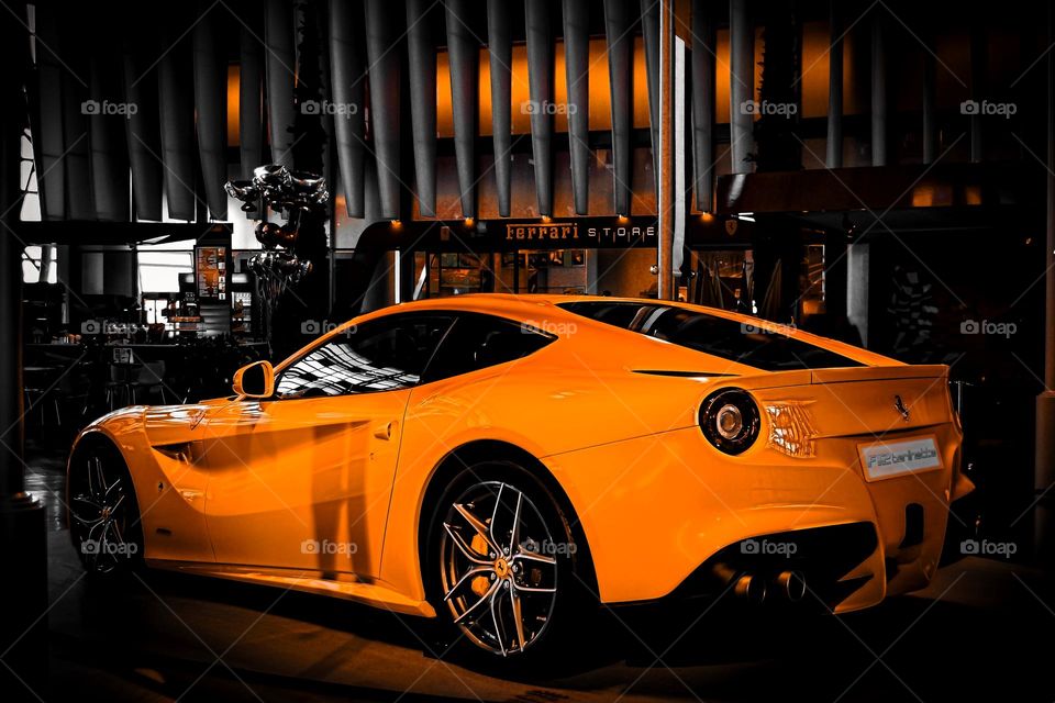 Ferrari racing car orange color on display at the Dubai Mall