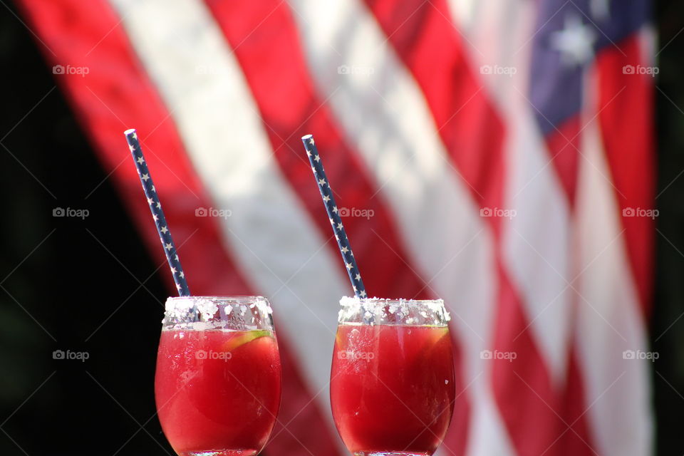 Close-up of juice in front of american flag