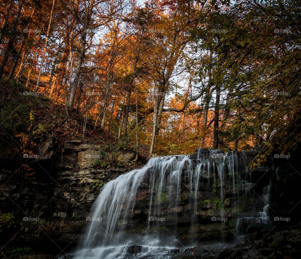 Small waterfall in an autumn forest