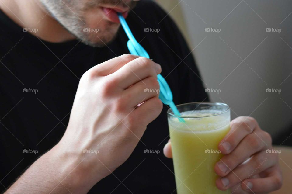 Man drinks vitamin drink