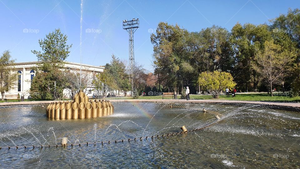 rainbow in the fontain in the park