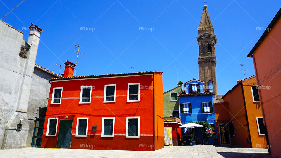 Colorful building house and church in Burano, Italy
