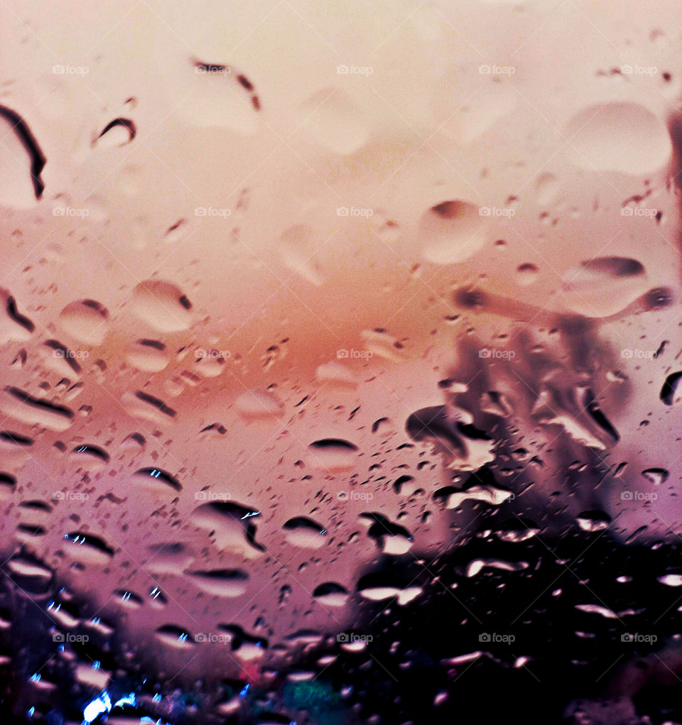 perfect rain drops on the glass of the car