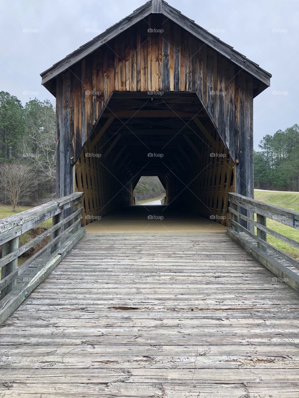 A 216 year old  front of a covered bridge sitting over a creek in southern Georgia. 