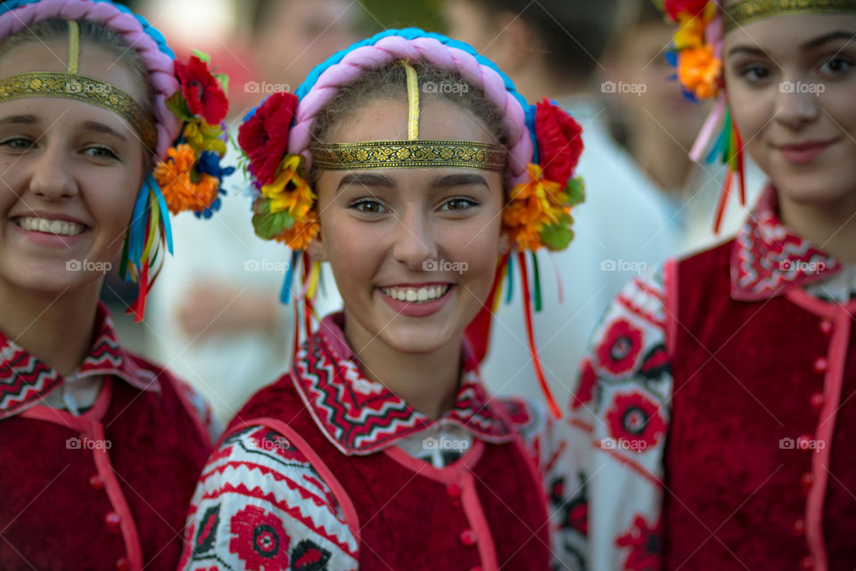 East or West?Street portrait of Ukrainian girl in national dress during selebration of independence Day in Ukraine