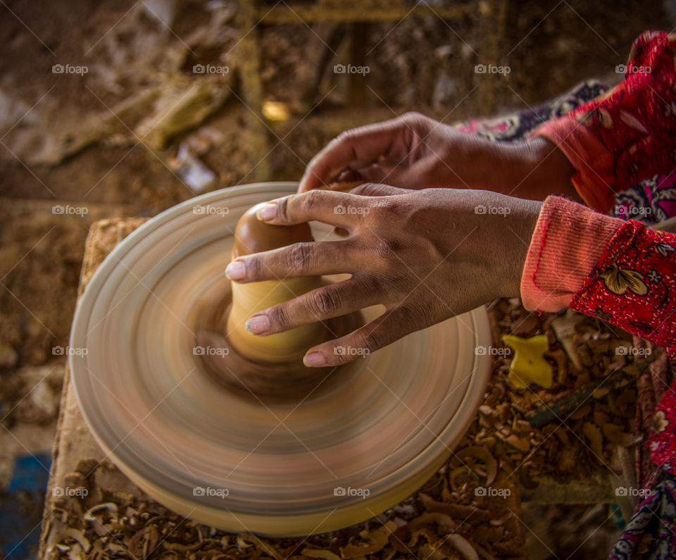 The hard working hands of the expert potter