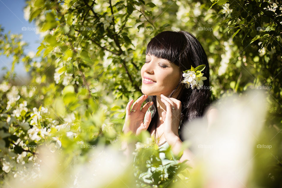 Relaxed young woman in garden