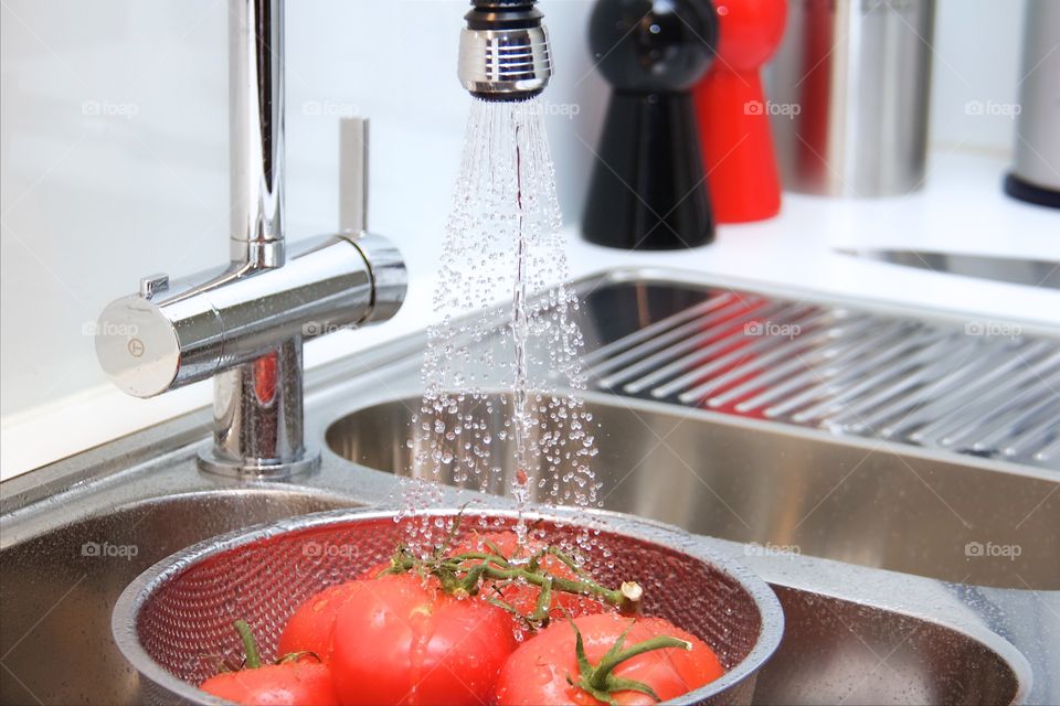 rinsing tomatoes