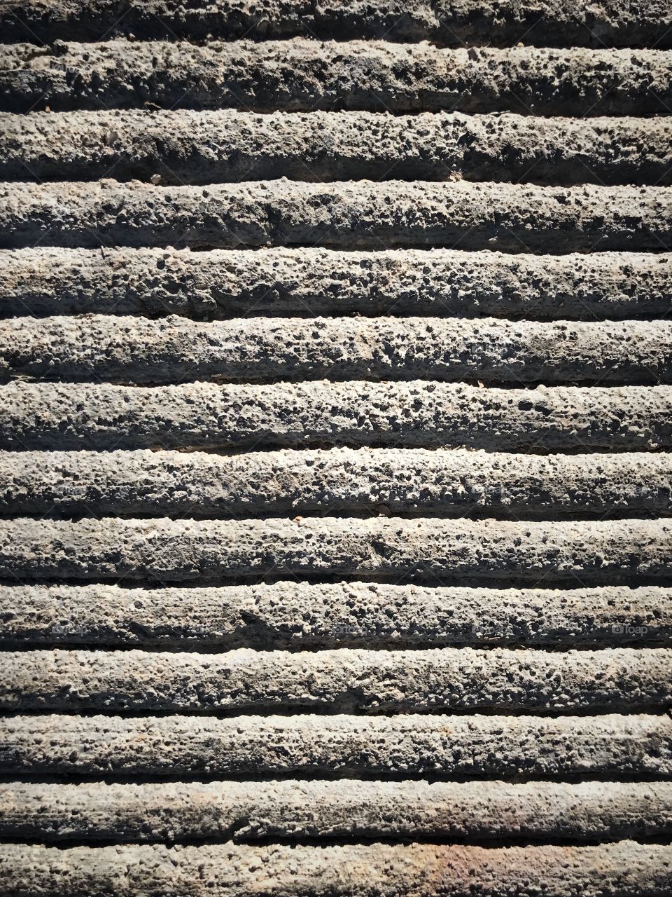 A pattern of rows drawn into cement 