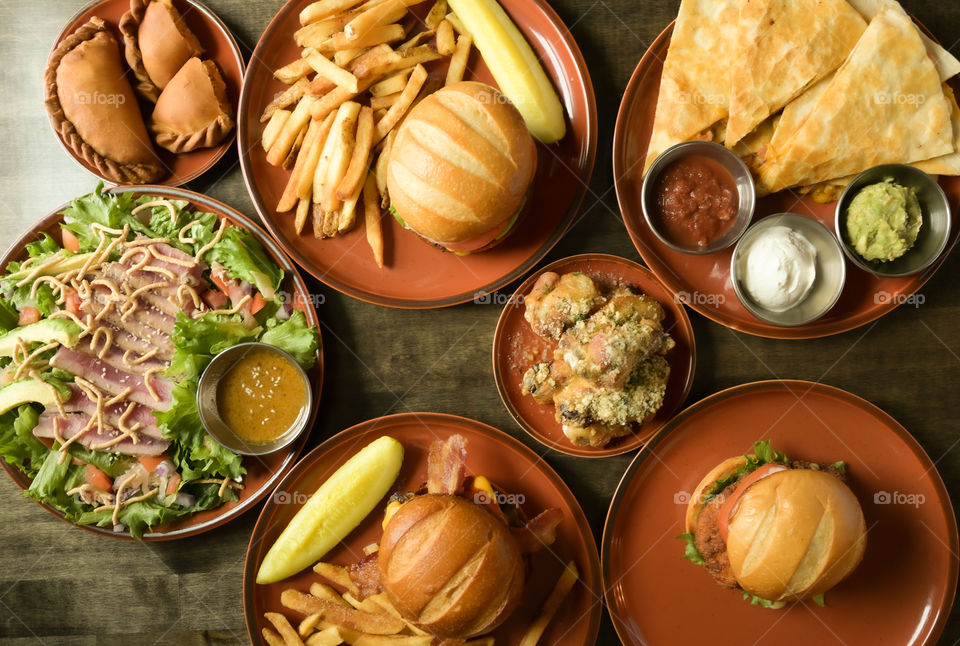 Tap down hearty rustic plated food on the table