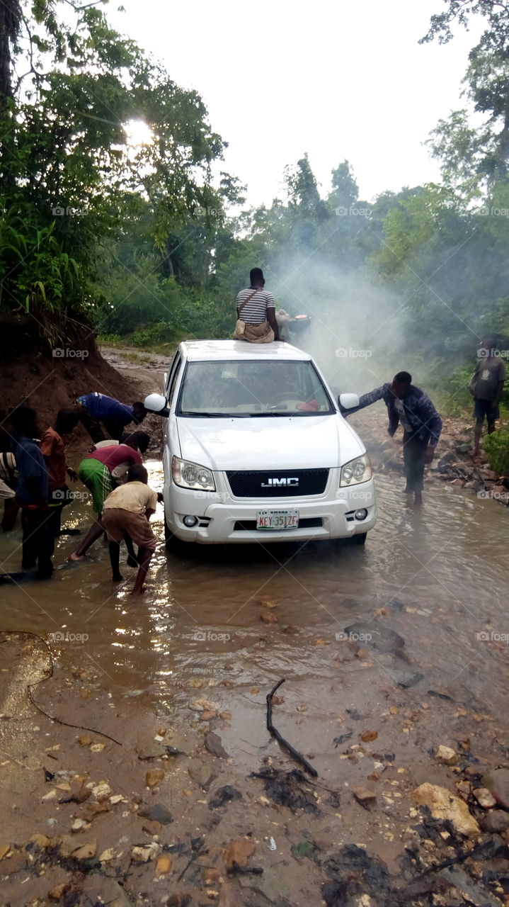 smokes near my car being washed at the stream