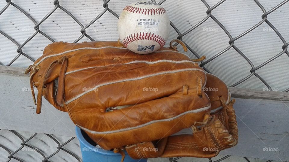 Baseball. The ball a Binghamton Mets player gave me sitting on the mitt my dad bought me when I was 9.