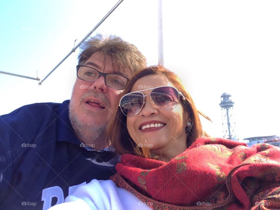 Couple walking by boat.