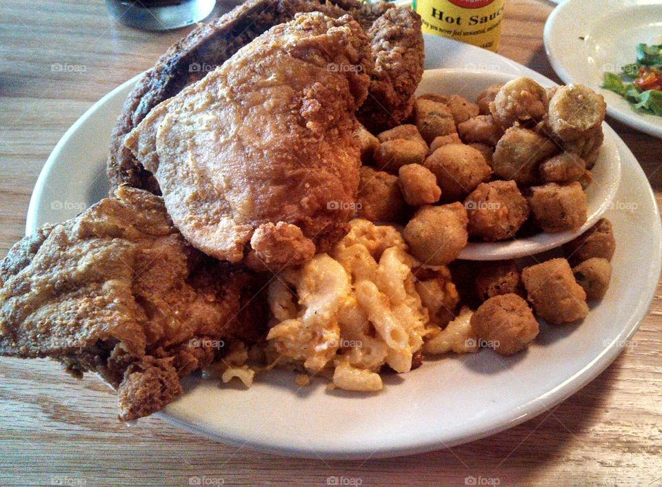 A dinner plate full of favorite Southern foods: fried chicken, fried okra, and macaroni and cheese!