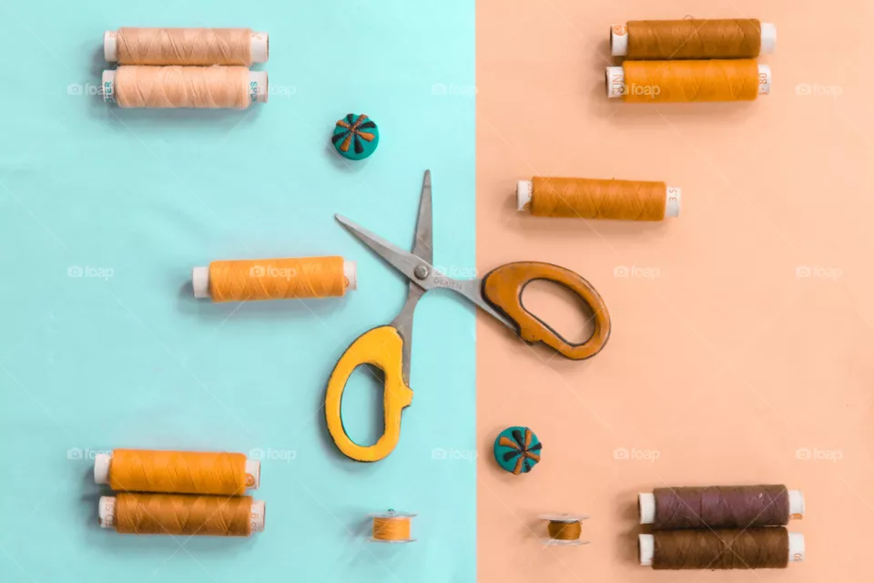 needlework and tailoring concept. scissors, sewing button and spools of thread.flat lay photography,top view.