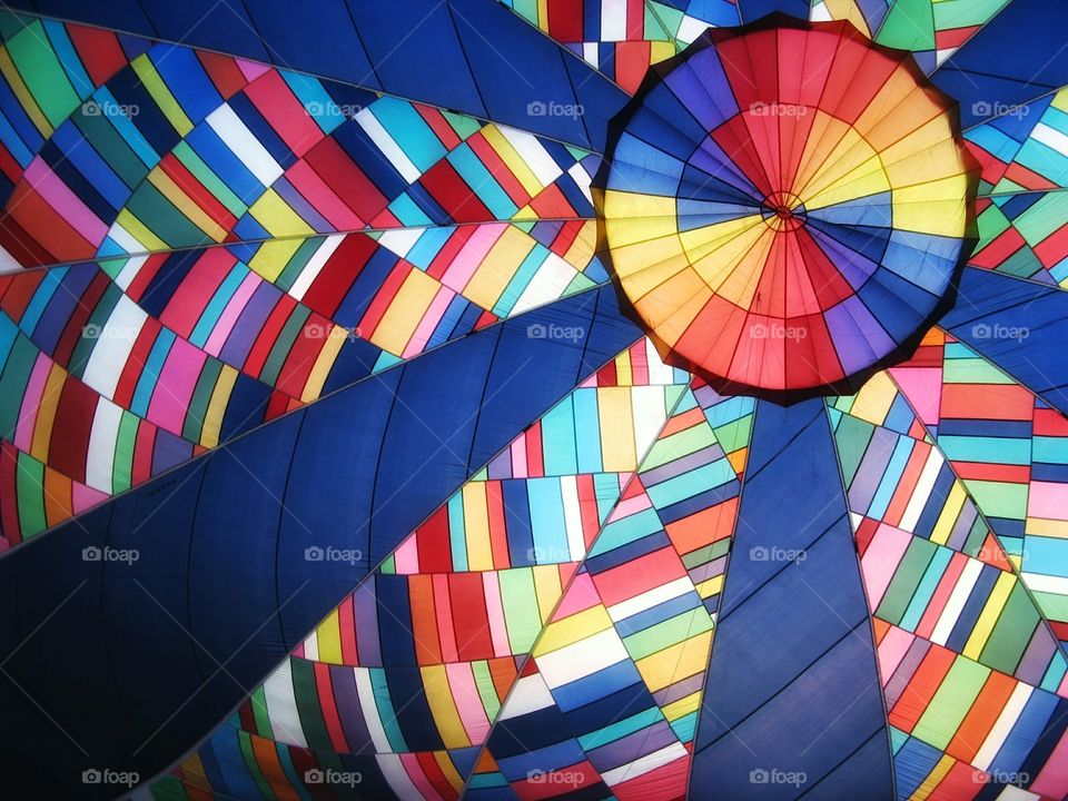 Inside a beautiful, big, colorful, giant hot air balloon.