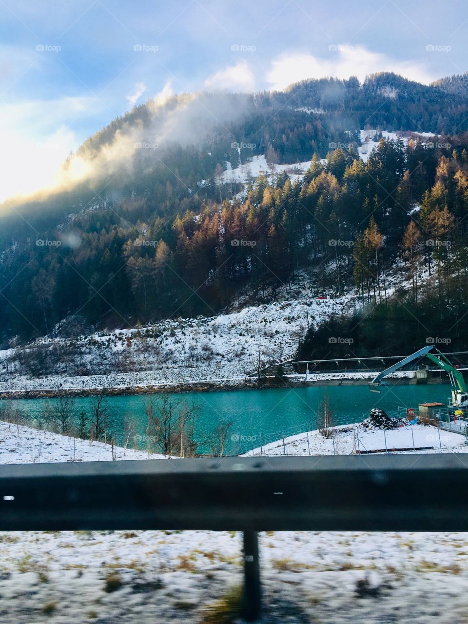 Picturesque view in Austrian mountains. Lazurite blue water, sunrise.