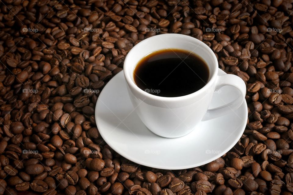Cup of coffee and coffee beans 