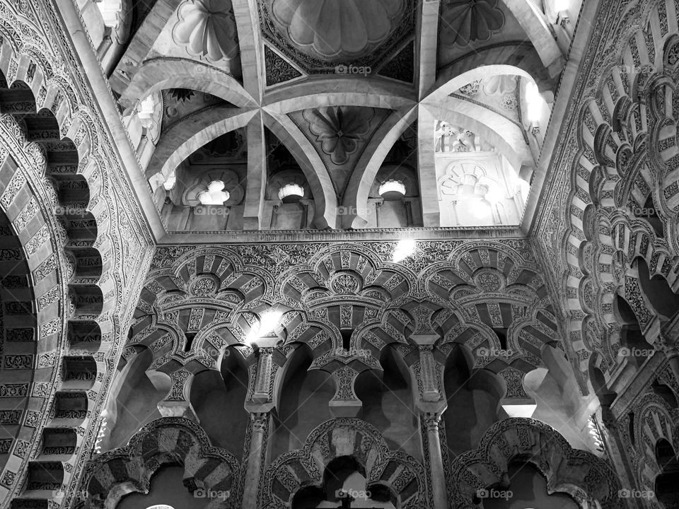 The beautiful and intricate decorations and arabesques of the arches of the Mezquita of Cordoba, the cathedral mosquea