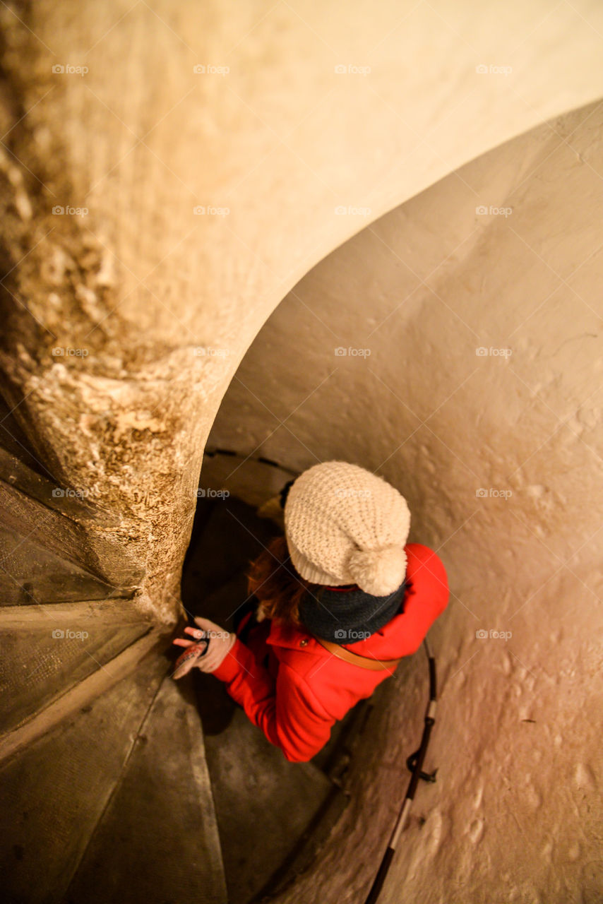 Girl walking down the round stairs