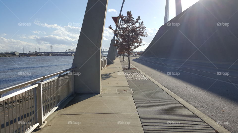 street and walkway between the arch and the Missouri river