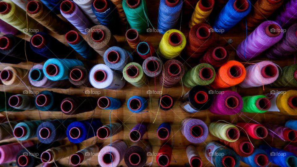 collection of sewing threads of various colors