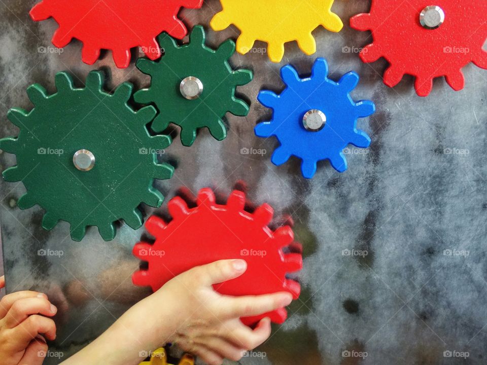 Hands Putting A Puzzle Together