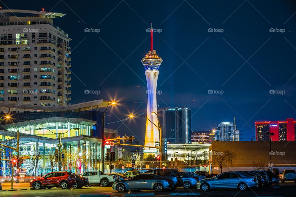 The STRAT (formerly the Stratosphere) lit in blue and yellow, the colors of Ukraine. Barely ever changing its colors, this is a bold statement coming from the casino hotel. Captured in long exposure at night from Downtown Las Vegas.