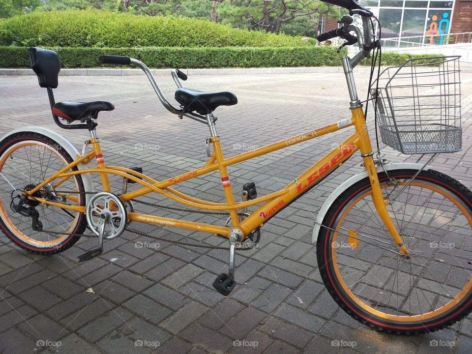 Yellow bicycle for 2 seats for a nice ridings.