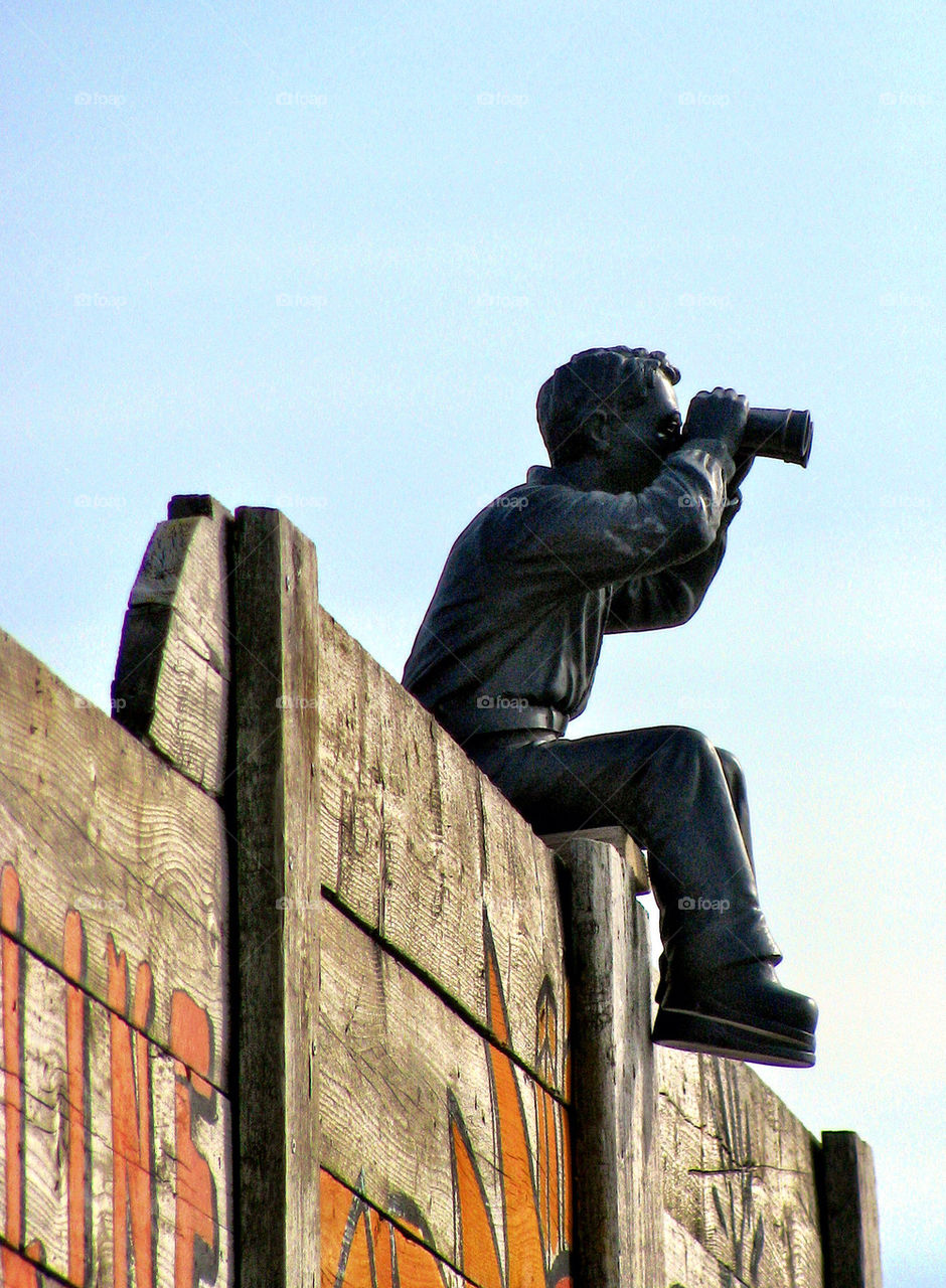 MAN WITH BINOCULARS