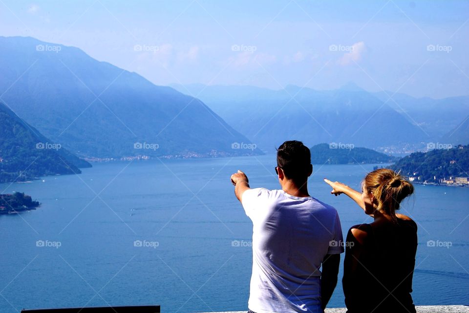 Varenna, Lake Como pointing to the distance