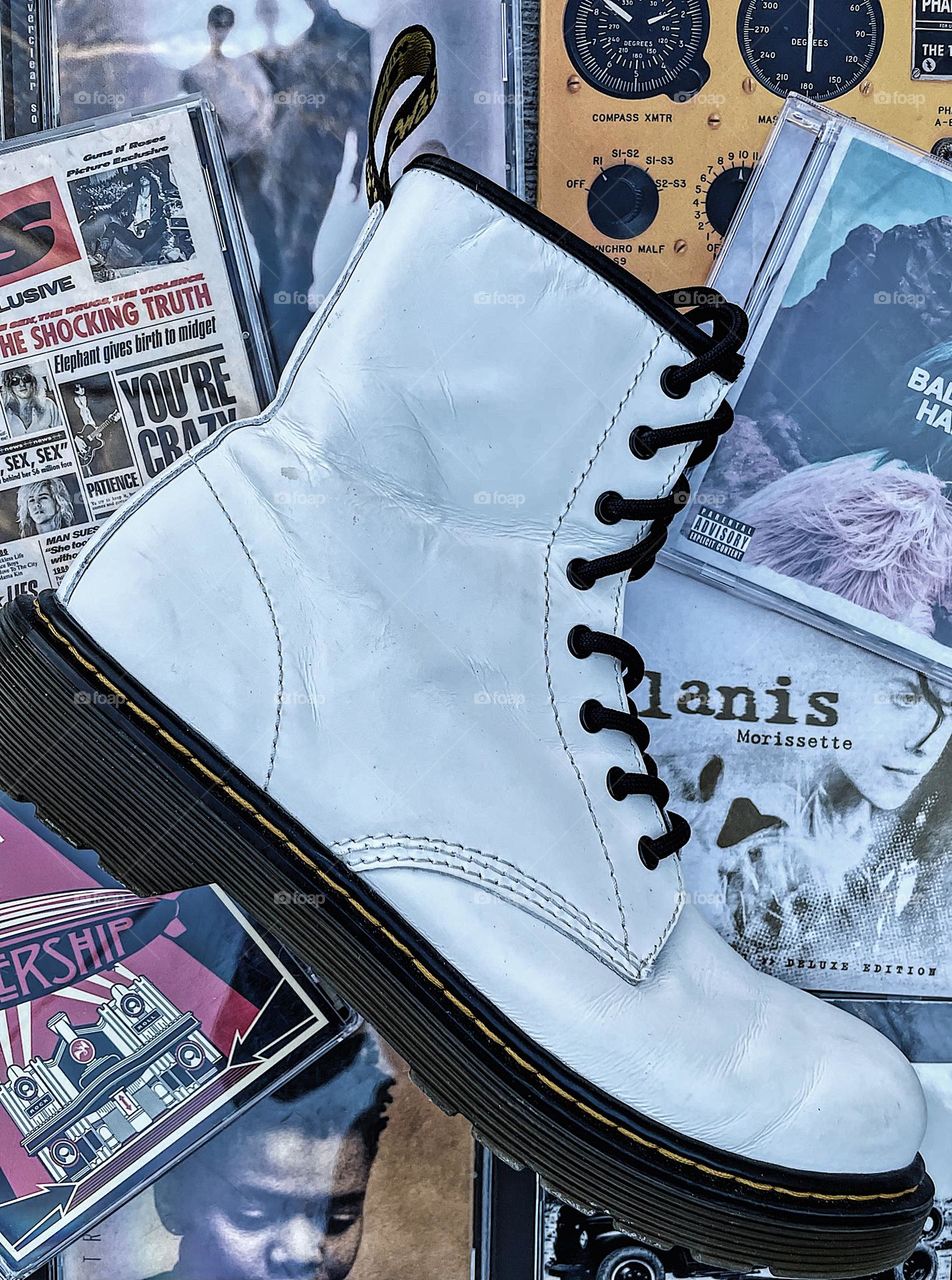 Doc Marten boots with CDs, music and Dr. Martens, vintage music and boots, white Doc Martens, laced up boot, CDs and DMs, Docs and CDs, retro vibes, 90s vibes, portrait of punk 