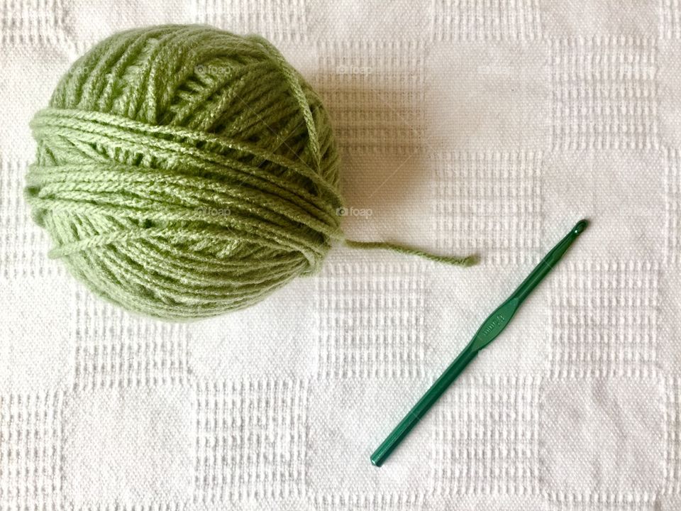 Green Yarn and crochet hook