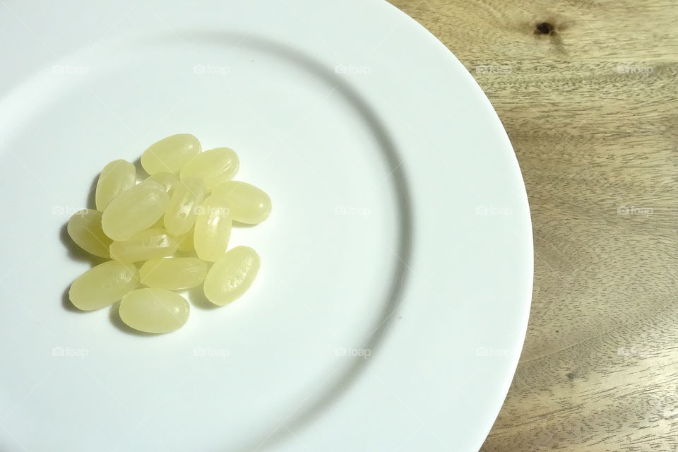 Honey candy served on a white dish.