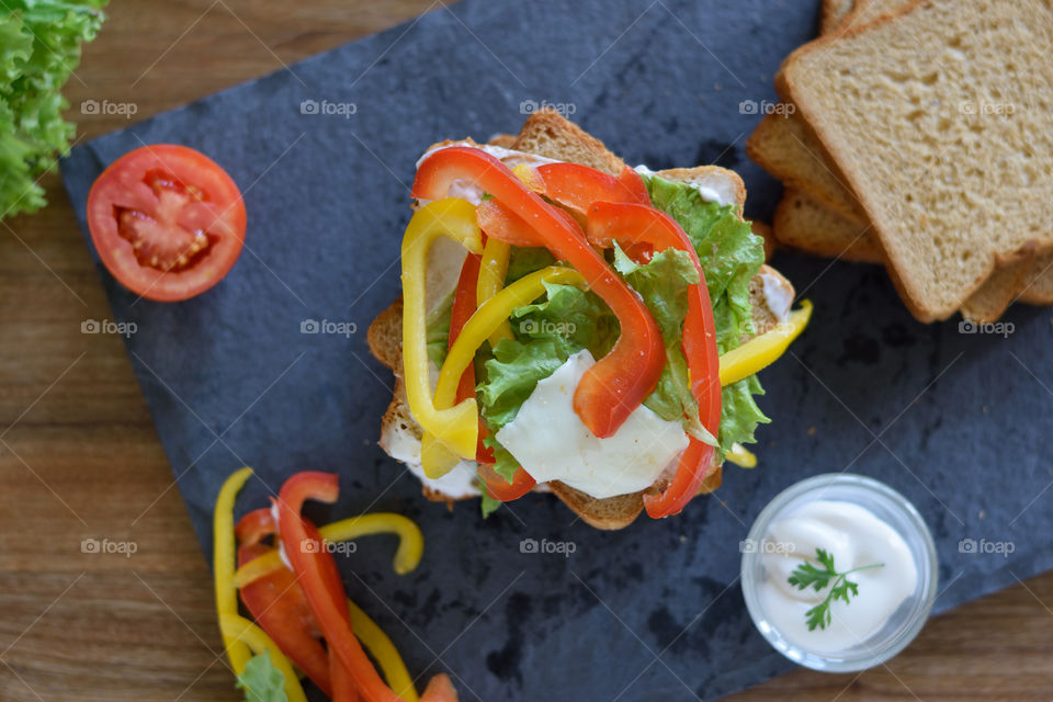 capsicum toppings and mayonnaise on a wheat bread