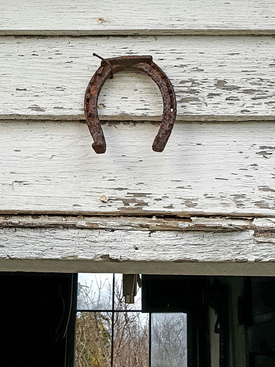 Although our family believe in blessings instead of luck, there's something extremely country about having a horseshoe hanging above the door. This one is above our smokehouse.