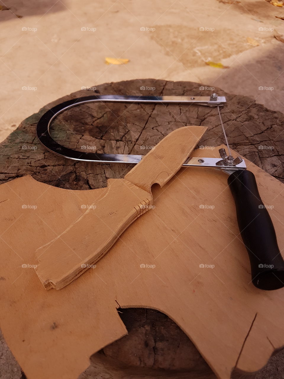 sawing a piece of wooden plywood with a jig saw, skills tool