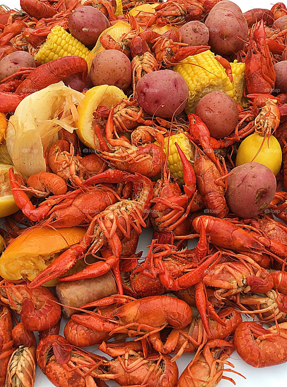Family and friends will gather around the table to indulge in Louisiana Cajun Crawfish boil along with corn on the cob, red potatoes, sausage and onions. 
