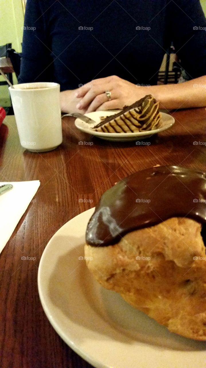 Cake and cream puff enjoyed during a date