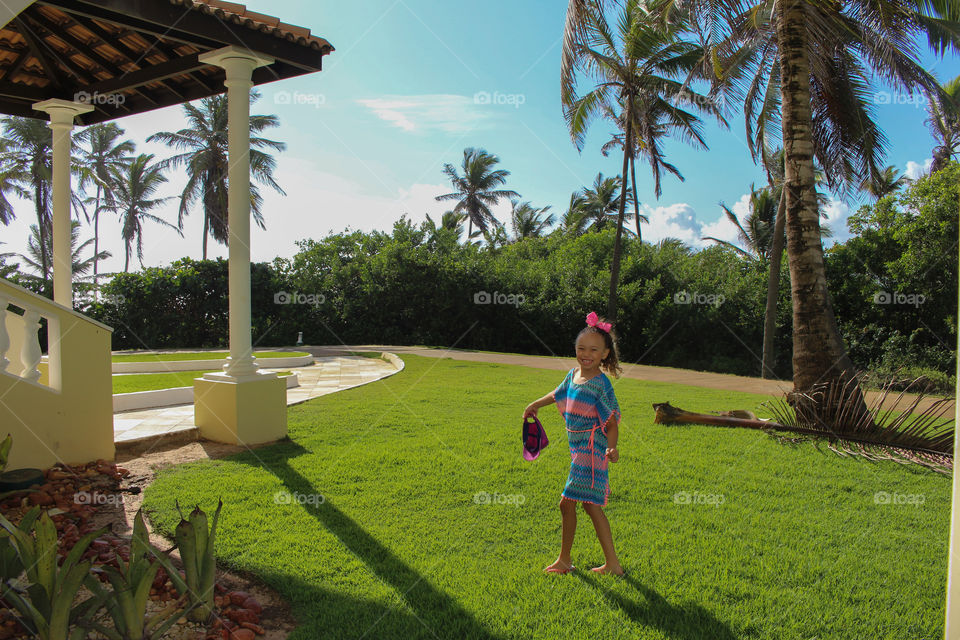 A beautiful sunny day for this little girl to go to the beach