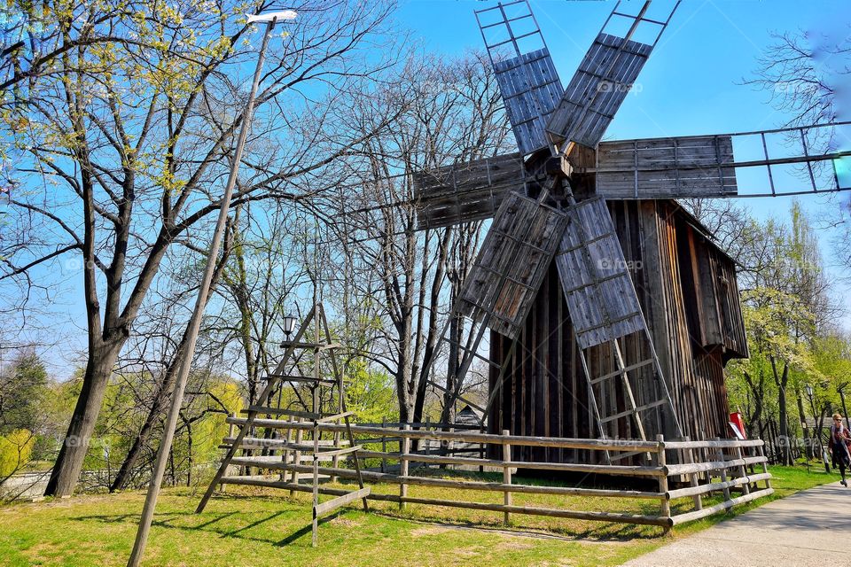 wooden windmill at national village museum in Bucharest,- Romania